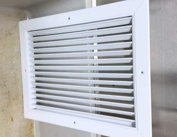 Clean white air vent grille after professional HVAC duct cleaning service